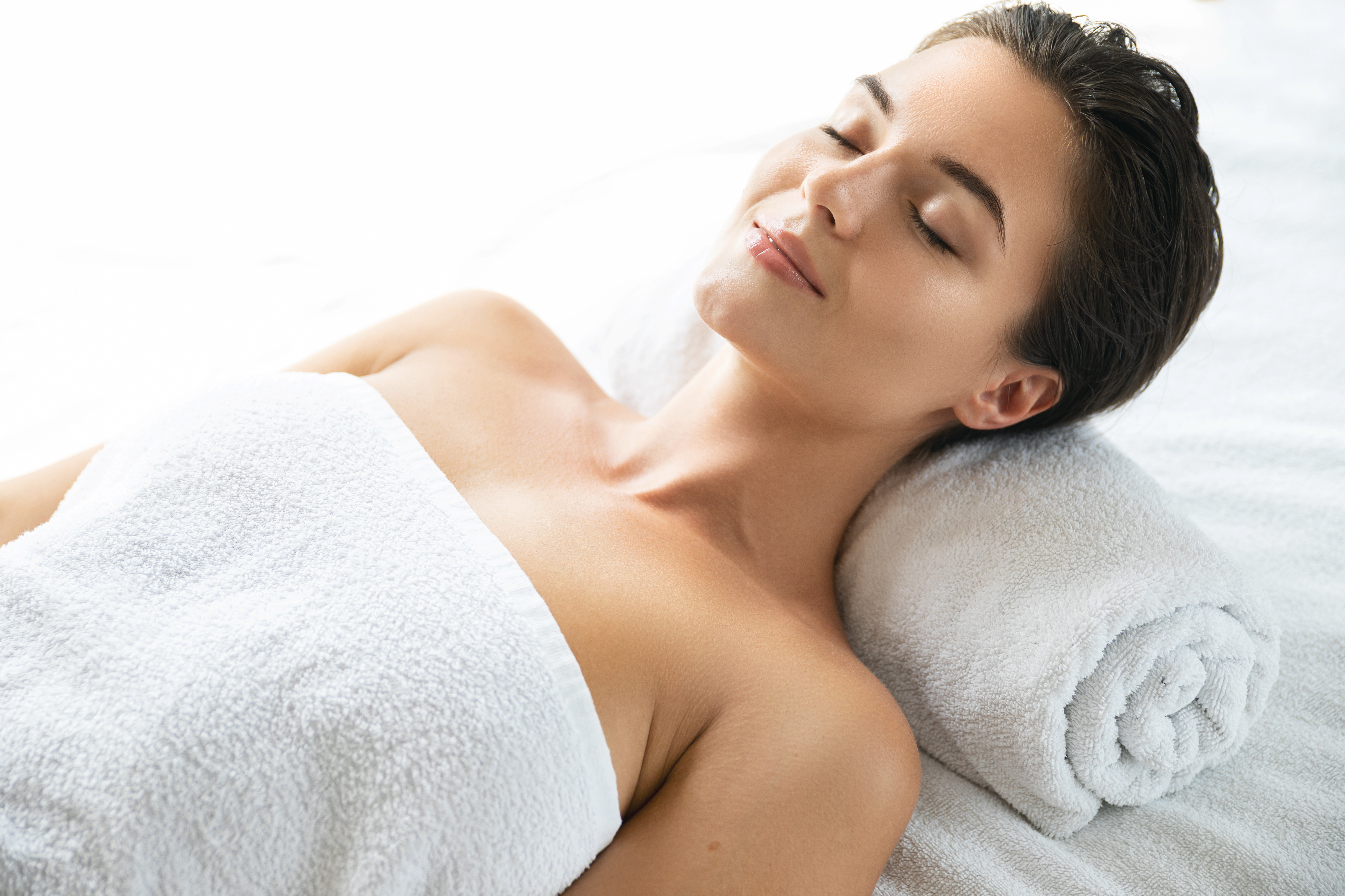 Young Woman Relaxing On Massage Table 